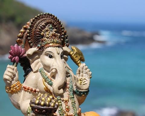 Lord Ganesha w modaka by the ocean