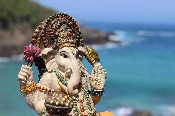 Lord Ganesha w modaka by the ocean