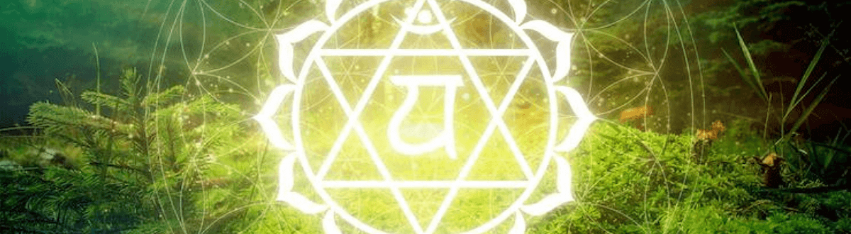 glowing heart chakra symbol in forest